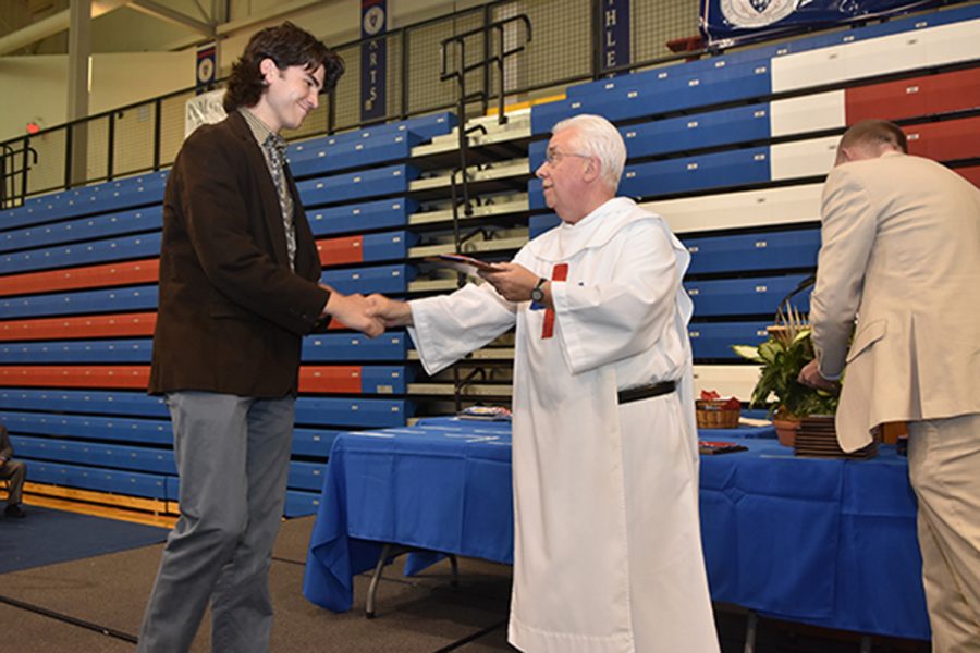 Father James gives Academic Award to Zach Misleh.