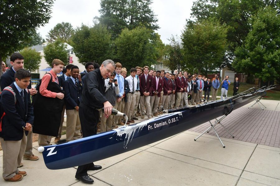 Father Damian christens new crew boat.