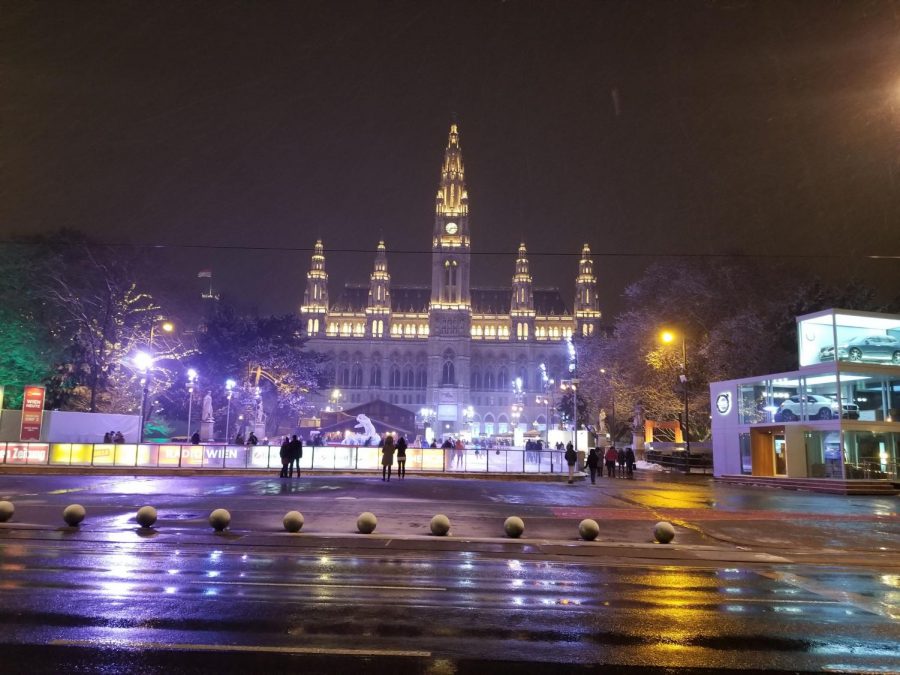 The Vienna city hall glows beautifully during a fun night of ice skating.