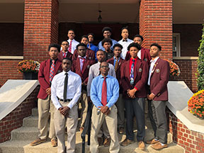 BSU members pose for a photo on the front steps of St. John DeMatha Hall.