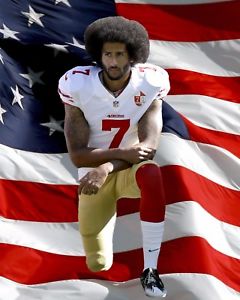 Kaepernick kneels for the national anthem.