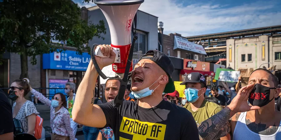 Rapper China Mac leads one of the several marches he and others in the AAPI community organized in 2020. Photo Credit: Ken Ji, 2020